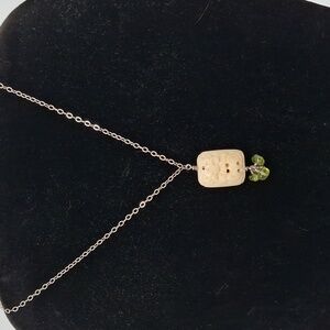 Carved Bone Tibetan Pendant On Sterling Silver Necklace with Green Peridot Beads